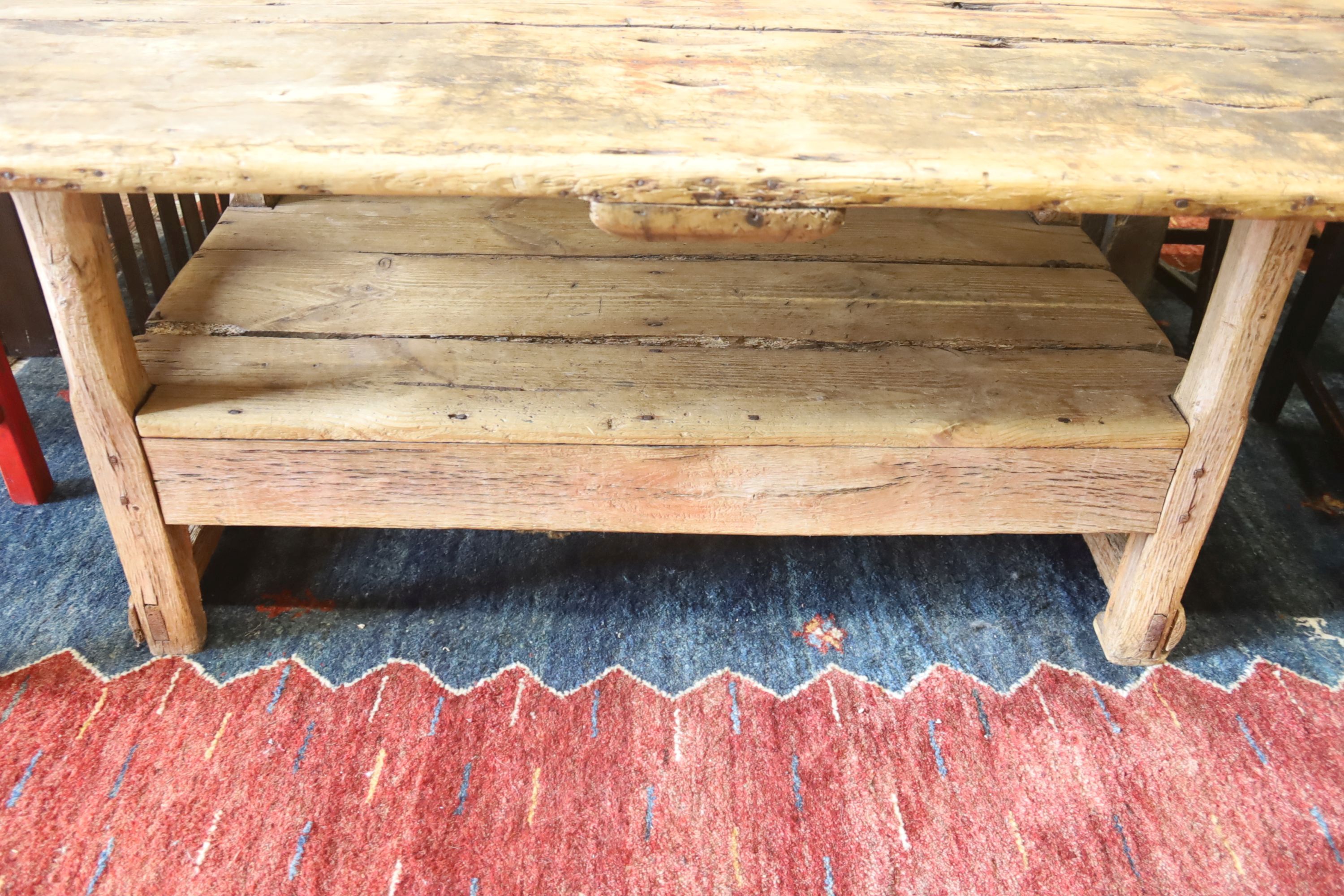 An 18th century French pine monks bench, width 160cm, depth 79cm, height 64cm